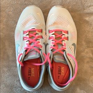 White and pink nike sneakers